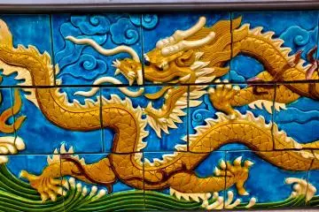<p>Large dragon mosaic at the base of the temple</p>