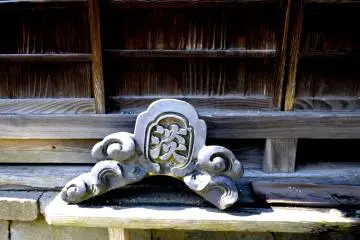 <p>Apex tiles often feature water motifs in the belief that this would help protect the building from fire</p>