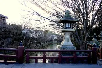<p>A stone lantern on a bridge over the canal</p>