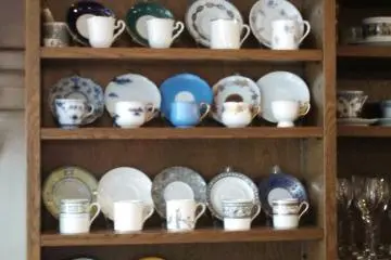 <p>You can ask for your tea to be served in any of the teacups on the back wall</p>