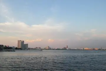 <p>Folks gather at the harbor to watch the sunset in Minato Mirai 21</p>