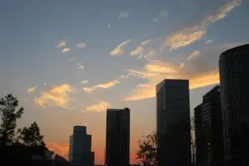 <p>Watch the sky come alive between buildings at sunset</p>