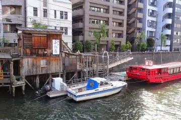 <p>Old wooden shack at Yanagibashi Bridge</p>