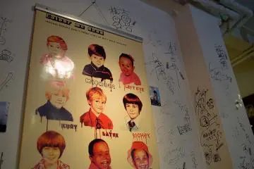<p>A poster on the wall depicting "fallen stars at their most innocent"</p>