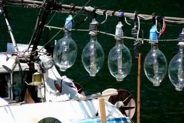 <p>Huge glass bulbs on a squid boat</p>