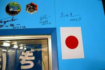 <p>Japanese astronauts' autographs on the surface of 'Kibo (Hope)' replica; you can read the names of renowned astronauts like Koichi Wakata and Soichi Noguchi</p>