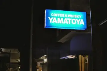 <p>The neon signage on the main street before reaching the entrance</p>