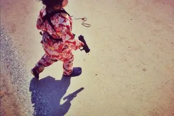 Some tots are armed, which is only fitting because...