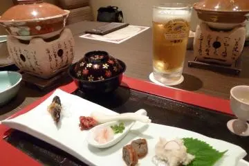 <p>Nothing feels better than a beer with local delicacies after a day of relaxing in the ryokan's hot springs</p>