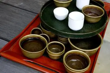 <p>Trays with cups of water on the verandah</p>