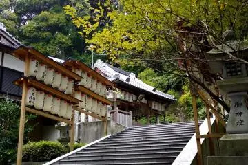 Red and white lanterns either side of stone steps