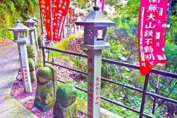 <p>A beautifully decorated bridge with many bright red banners near Oyama Cable Car Station</p>