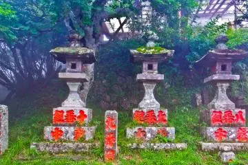 <p>Several stone monuments marking the short approach to Upper Afuri Shrine</p>