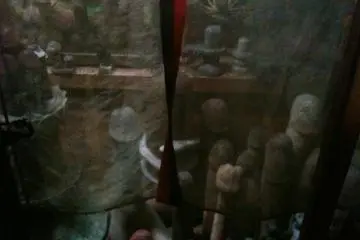 concealed behind gauze curtains, part of the temples penis collection.
