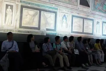 <p>Listening to a short lecture in the Sistine Chapel room</p>