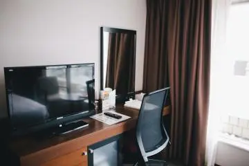 <p>Desk area and television</p>
