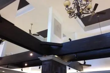 Chandelier and open beam ceiling