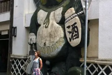 <p>Another funky izakaya, the tanuki figure is to attract people to such places.</p>