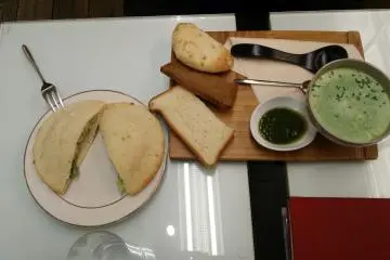 <p>This is broccoli soup with a "green pita sandwich" - lettuce and an edamame (young soy bean) and potato salad</p>