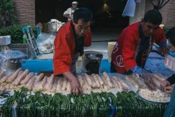 <p>Vendor arranging his produce.&nbsp;</p>
