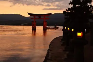 <p>The evening lanterns are now lit...soon the big torii gate will be floating on the sea</p>
