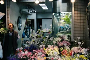 <p>Florist and her flower shop.</p>