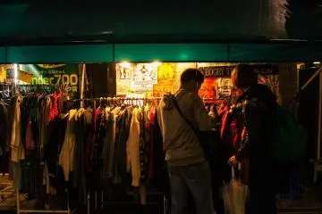 <p>Shoppers looking at thrift stores even at night.</p>