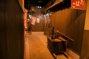 <p>Old advertising posters decorate the wall for a more authentic feel.&nbsp;</p>