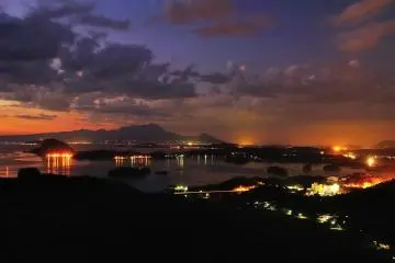 The sunset view from Mount Sengan, with Kami Amakusa city at the bottom right, and Shimabara Peninsula on the far left