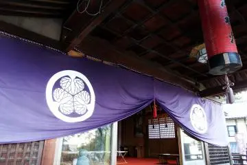 <p>Purple curtain hanging at the entrance of the prayer hall</p>
