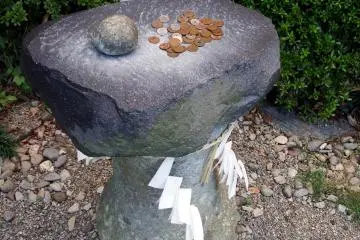 Votive Stone; It's said that if you hit the big rock with a small stone three times your wish will come true