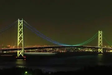 <p>Night view of Akashi Strait Bridge seen from Awaji Island, showing the time signal pattern.</p>