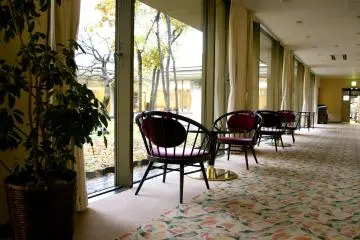 <p>Tea tables by the window right next to the lobby</p>