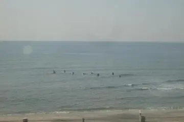 <p>Some surfers taking on the waves around Shichirigahama</p>