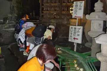People are washing their bills and coins in the spring water, hoping for wealth and riches in their future.