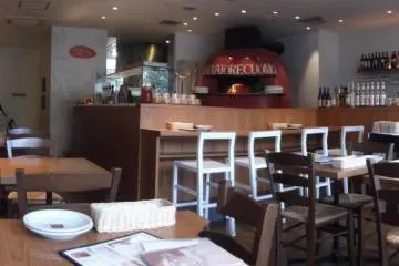 The open kitchen allows you to watch the chefs prepare your food