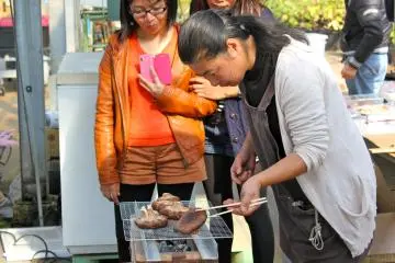 <p>Grilling the mushrooms we harvested from the greenhouse</p>