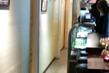 <p>The very narrow doorway into the narrow restaurant, and Turkish Cartoon Network on the TV</p>
