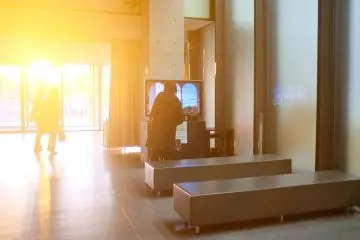 <p>A TV that displays information relating to the museum and the exhibitions</p>