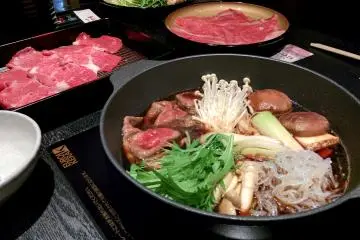 <p>Sukiyaki and prepared meats waiting to be cooked</p>