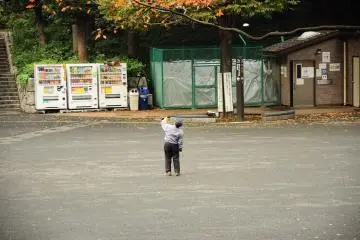 <p>An elders playing with his paper-airplane by himself</p>