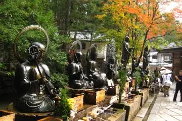 <p>just before reaching Kukai's (aka Kobo Daishi) mausoleum at the main hall, pilgrims wash their hands, say wishes, and splash water on the Buddhist statues (Photography is forbidden soon beyond this point.)</p>