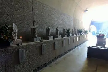 <p>Each statue has the name of the temple, and number of pilgrimage written on it</p>