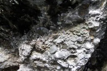<p>Closer look at the eroded rock in the cave. Probably some fossils can be found here!</p>