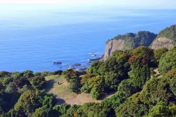 View of the rocky Echizen Beach and the hillside in mid October