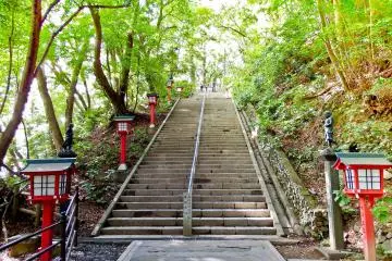 The final staircase leading up to Yakuo-in Temple where you will notice many red lanterns and several black statues representing some of Takao`s many Guardian Deities