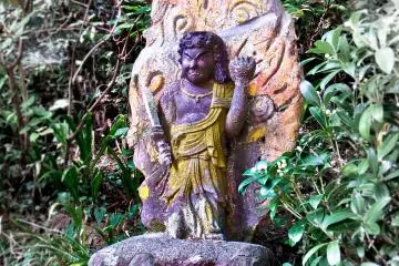 <p>Close to the entrance of Okunoin Fudo-Hall is this depiction of the Guardian deity Fudo-Myo. Despite its devil like appearance, this &ldquo;God of Fire&rdquo; is also believed to protect and bring good fortune to worshippers</p>