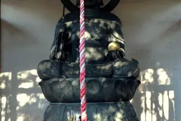 <p>Buddha and bell rope</p>