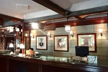 The front desk. Notice the three photos on the wall: One is Isabella Bird.