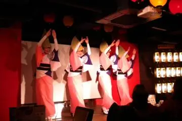<p>Members of one of Koenji's famous Awaodori dance troupes performs on stage.</p>